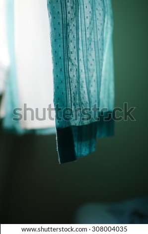 Curtain blowing in wind