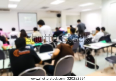 Blur student during study or lecture and quiz or exams from teacher or professor in classroom with notebook in master degree of industrial management programs or MBA at Thailand university