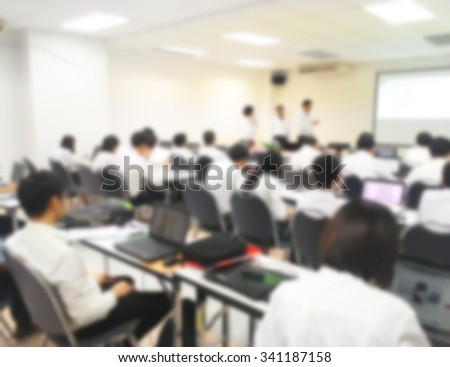 Blur behind student or collegian study, lecture in classroom with notebook and screen projector in bachelor or master or Ph.D. degree in university, college or business seminar, business meeting