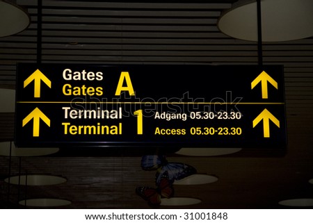 Airport sign pointing the direction for gates and terminals