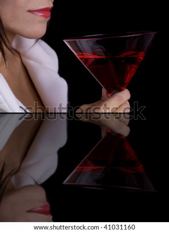 Woman with cocktail and her reflection