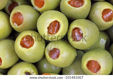 A close view of small stuffed green olives.