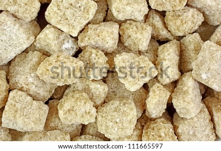 Looking down at a group of sugar cane cubes.