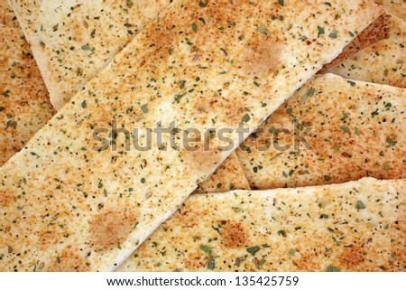 Looking down at close view of  flat bread cracker strips.