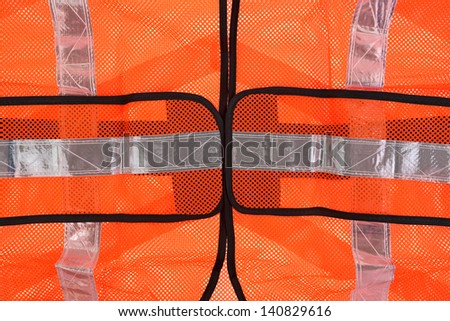 A close view of the front mid section of the safety vest.