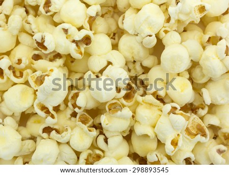 A close view of crunchy and delicious white cheddar cheese popcorn.
