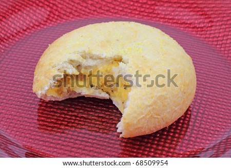 A tempting bite of egg, cheese and sausage pastry.