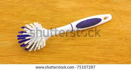 The underside of a dish and bottle scrubbing brush.