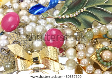 A group of a variety of vintage jewelry.