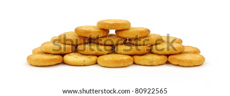 A front view of stacked small bite size crackers.