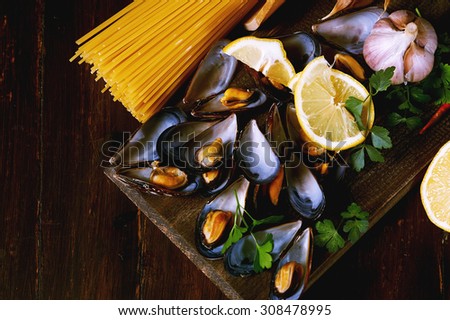 Pasta with seafood spaghetti with mussels on a dark background