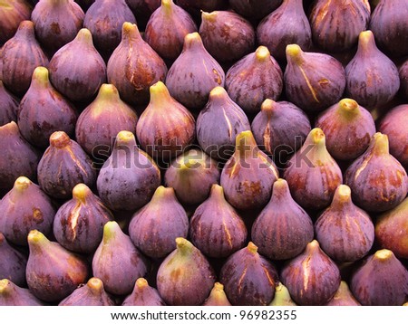 Display of fresh figs at a fruit market. Can be used as a healthy food background.