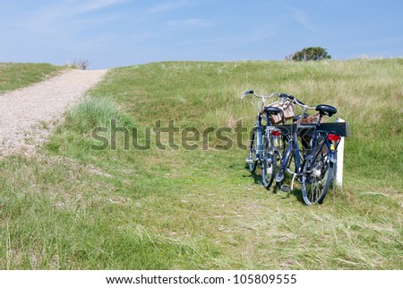 Two bicycles parked in the dunes, the Netherlands.