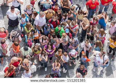 PRAGUE, CZECH REPUBLIC - JUL 21: Top view of unknown tourists waiting at the old town square in the center of the Czech capital city on July 21, 2009 in Prague, Czech Republic