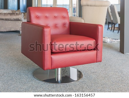 Showroom modern furniture shop with luxury red leather armchair