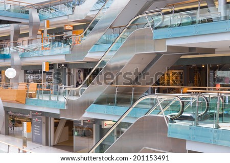 AMSTERDAM, THE NETHERLANDS - MAY 23: People shopping in the Dutch indoor shopping mall Villa Arena with escalators on May 23, 2014 in Amsterdam, the Netherlands