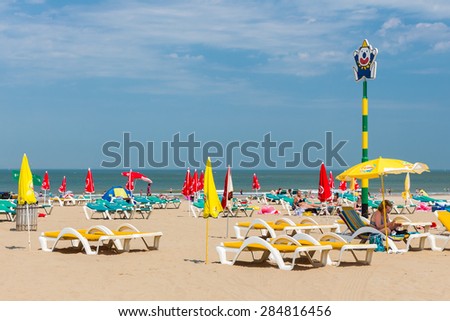 SCHEVENINGEN, THE NETHERLANDS - JUN 05: Seaside visitors relaxing in beach chairs at the first hot summerday on June 5, 2015 at the beach of Scheveningen, the Netherlands