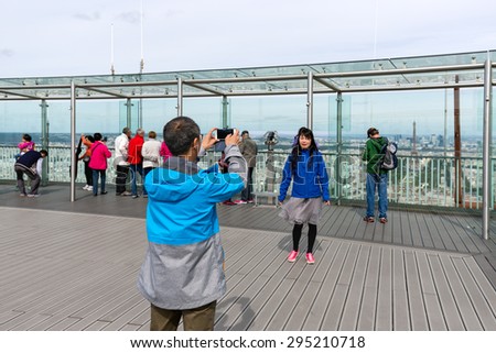 PARIS, FRANCE - May 29: Tourists making pictures from the viewing platform of the Montparnasse tower on May 29, 2015, Paris, France