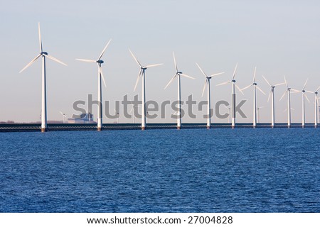 Long row of Dutch wind-turbines in the sea