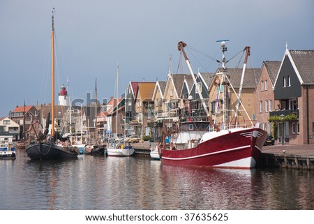 Traditional and modern fishing cutter in the harbor of Urk, the Netherlands
