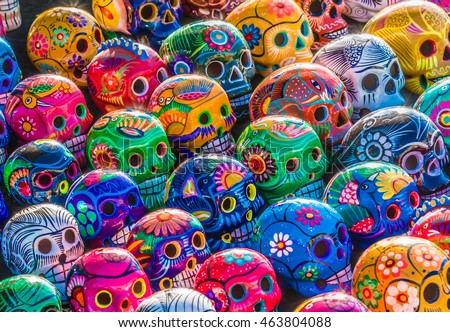 Mexican Culture Celebration: Colorful (colourful) traditional Mexican/hispanic ceramic pottery Day of the Dead (Dia de los Muertos) skulls on display at a market in Mexico.