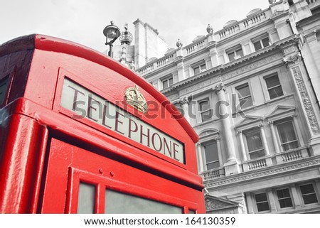 Red Telephone Booth in London street day time