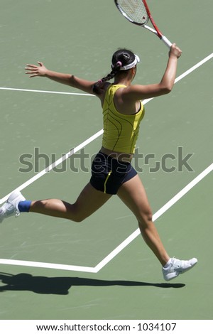 Tennis player doing a running forehand