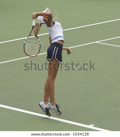 Tennis player serving
