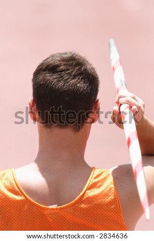 An athlete throwing a javelin in a sporting event