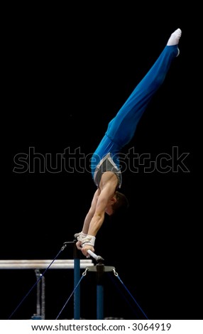 An athlete performing on the uneven bars