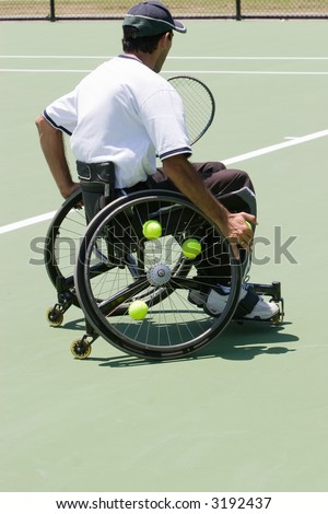 A wheelchair bound athlete on the tennis court