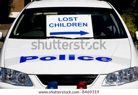 A police car with lost children sign