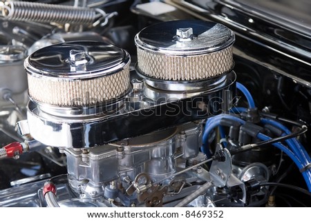 An automobile engine with twin carburettors and air filters