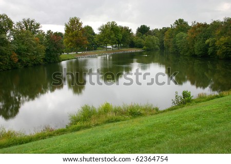 a small man-made lake in an affluent residential community