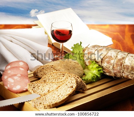 snack with bread meats and wine
