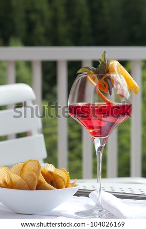 red cocktail in the garden