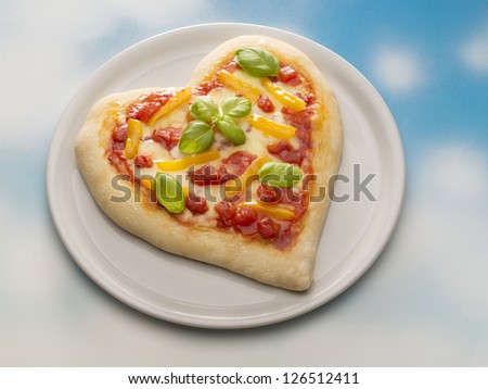 Pizza in the form of heart on the dish