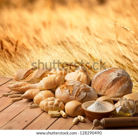 Bread And Oil On The Wooden Table