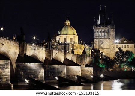 The night View on bright Prague Old Town with the Charles Bridge and its Bridge Tower, Czech Republic