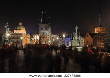 The night View on bright Prague Old Town with the Charles Bridge and its Bridge Tower and Sculptures, Czech Republic
