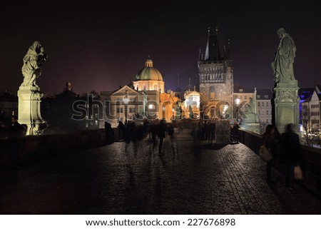The night View on bright Prague Old Town with the Charles Bridge and its Bridge Tower and Sculptures, Czech Republic