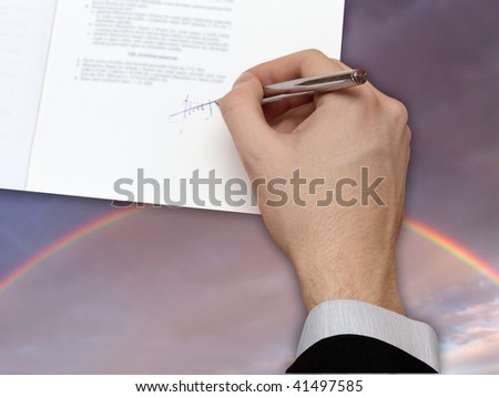 Signature of Business Contract on the blue Sky with the Rainbow