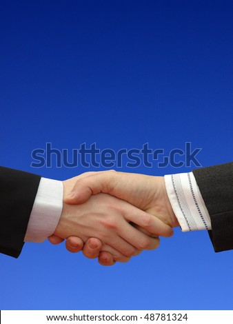 Businessmen shaking hands front of  the blue Sky