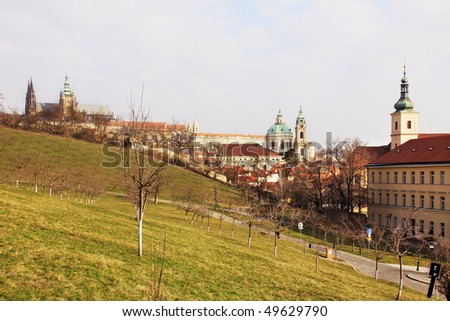 Early Spring in Prague - view on Prague St. Nicholas' Cathedral with Prague Castle