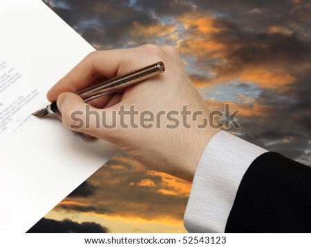 The Signature of Business Contract on the dramatically Sky