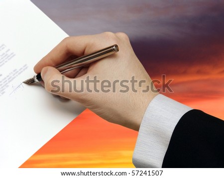 The Signature of Business Contract on the dramatically Sky