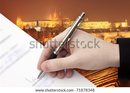 The Signature of Business Contract in front of the Prague Panorama