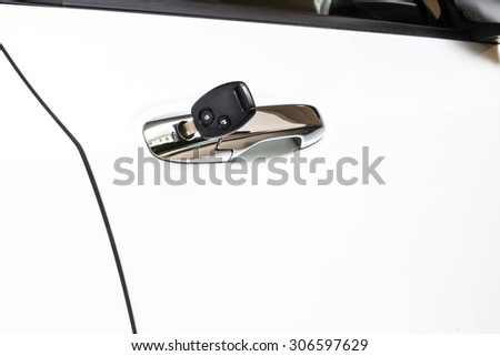 Car key in the car door hole.