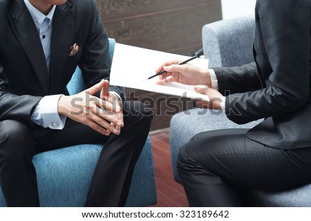 Businessman and Businesswoman Meeting on Sales Pitch
