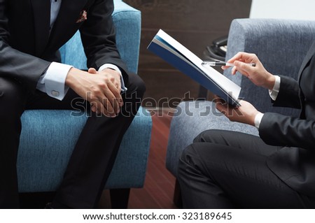 Businessman and Businesswoman Meeting on Sales Pitch